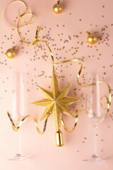 champagne glasses and gold christmas tree decorations.
