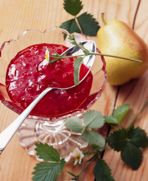 Strawberry And Pear Jam In A Glass Bowl