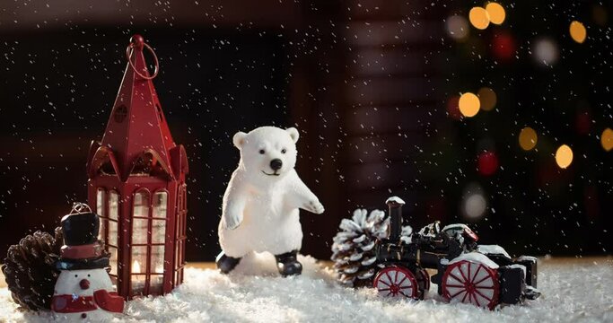 Animation of christmas decoration with lantern, bear and snow falling
