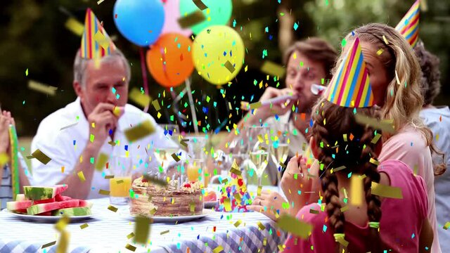 Animation of multi coloured confetti falling over family in party hats