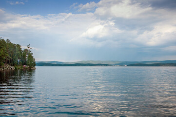 Clouds above hills on Turgoyak lake in Ural