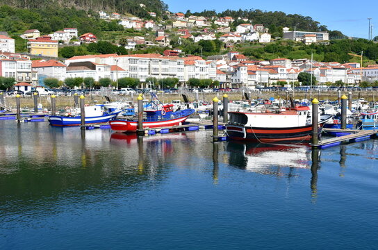 Harbor and coastal village with galician fishing vessels and sailing boats at famous Rias Baixas in Galicia Region. Muros, A Coruña, Spain.