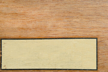 Naklejka premium Frame on wooden background