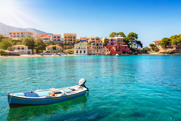 The idyllic village of Assos on the Ionian island of Cephalonia, Greece, with emerald sea and colorful, red roofed houses until the beach