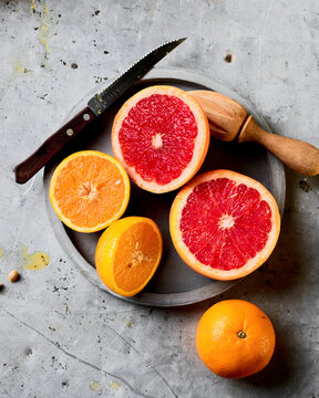 Freshly cut oranges ready to be squeezed