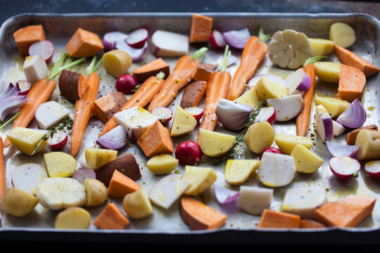 Sliced vegetables on a baking sheet