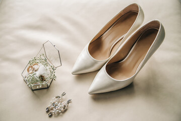 White shoes, earrings and rings