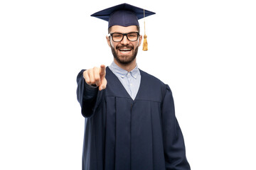 education, graduation and choice concept - happy smiling male graduate student in mortar board and...