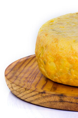 Tasty spanish omelette on a wooden tray on white background