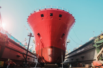 Ship repair in shipyard, Low angle Ship moored in floating drydock yard fore Maintenance,