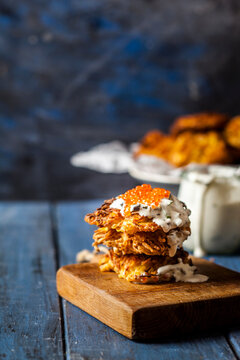 Latkes with fried leeks, sour cream and red trout caviar