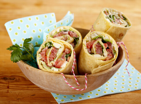 Vegetarian wraps with tomato, olive, and sheep's cheese filling