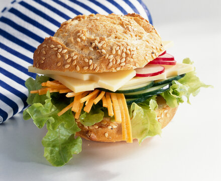A sandwich with emmental and vegetables