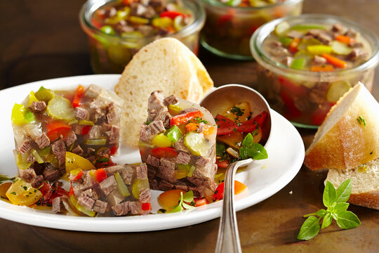 Roast beef stock with cherry tomato vinaigrette and white bread
