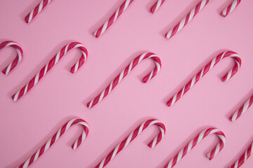 christmas candy cane, on a pink background