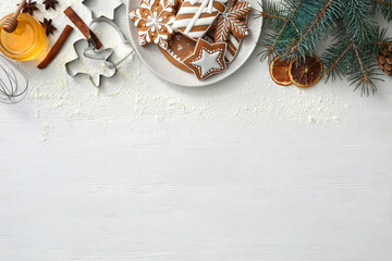 Flat lay composition with delicious homemade Christmas cookies on white wooden table. Space for text