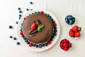 Delicious Chocolate Cake with Raspberry, Blackberry, Mint and Strawberries