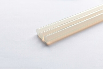 Hot glue gun sticks isolated on white background.