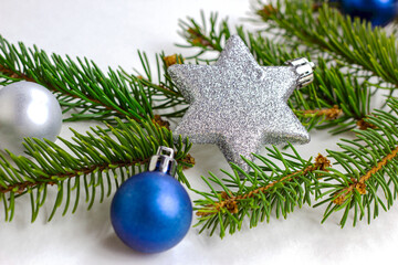 New Year and Christmas decorations with green fir tree branches and Xmas traditional decor with copy space for greeting invitation cards.