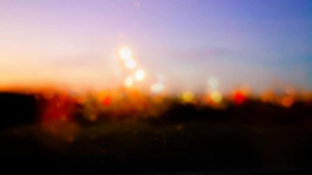 Atmospheric abstract colorful background, city lights at night blur. 