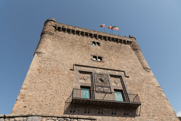 Fototapeta na wymiar Stone-made historical medieval tower in Potes, Cantabria, Spain under a clear sky