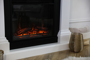 Modern fireplace in room, closeup. Interior design