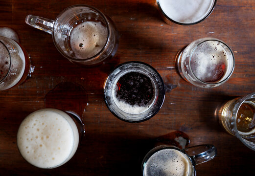 Different beer styles in process of being consumed