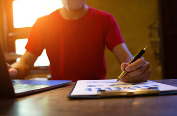 businessman hands searching for data on Notebook with tax online  work at home.concept