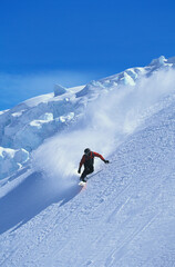 Fototapeta na wymiar Man Snowboarding On Slope