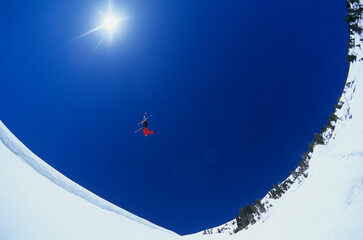 Skier Performing Flip On Snow Mountain