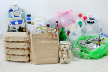 Various garbage for recycling. Paper, cardboard, metal and glass prepared for recycling. Waste to...