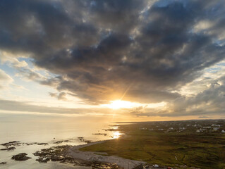 Aerial drone view on sunset over Atlantic ocean, West coast of Ireland, county Galway, Dramatic sky.