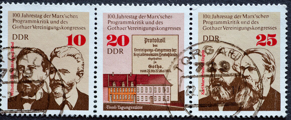 GERMANY, DDR - CIRCA 1975 : a postage stamp from Germany, GDR showing the Gotha Association Congress. Portraits of Wilhelm Liebknecht, August Bebel, Karl Marx and Friedrich Engels