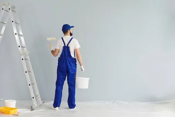 Foto op Aluminium Bearded painter contractor preparing to paint wall © Studio Romantic