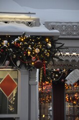 Christmas home decoration with balls, garland and snow