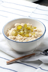 Oatmeal porridge with homemade gooseberry jam