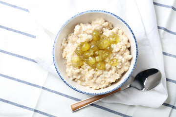 Oatmeal porridge with homemade gooseberry jam