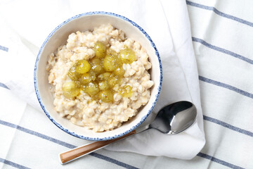 Oatmeal porridge with homemade gooseberry jam