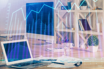 Financial chart drawing and table with computer on background. Multi exposure. Concept of...