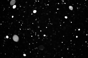 snow bokeh texture on black background
