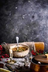 Cabbage rolls soup in a ceramic bowl on a wooden old table. Rustic background .style rustic