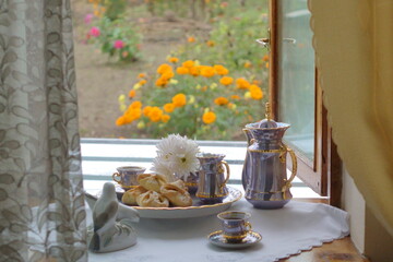 Still life morning coffee, cookies and flowers
