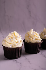 Cupcakes decorated with vanilla cream