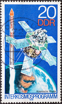 GERMANY, DDR - CIRCA 1978 : a postage stamp from Germany, GDR showing a satellite Interkosmos 1 (Cosmic Physics). Intercosm program