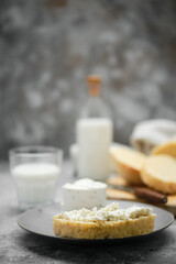 Healthy breakfast with homemade yeast-free bread, soft cheese and milk