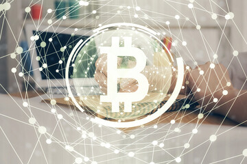 Cryptocurrency hologram over hands taking notes background. Concept of blockchain. Multi exposure