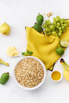 Breakfast oats with grapes, feijoa, limes, bananas and pears