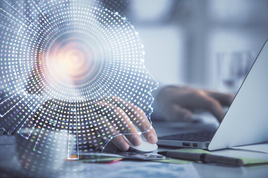 Man typing on keyboard background with brain hologram. Concept of big Data.