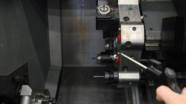 CNC machine cleaning after milling and drilling with air pressure