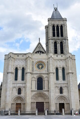 Fototapeta na wymiar Basilica of Saint-Denis or Basilique royale de Saint-Denis. Facade and bell tower. Paris, France.